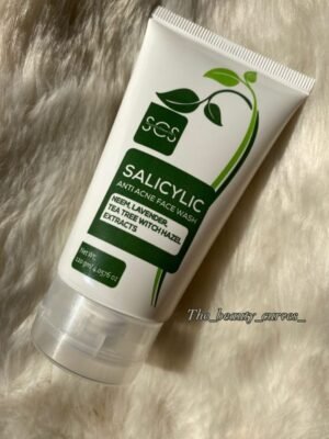 A white tube of "Success Chaser 100+" Salicylic Anti Acne Face Wash with green botanical leaf graphics, containing neem, lavender, tea tree, and witch hazel extracts.